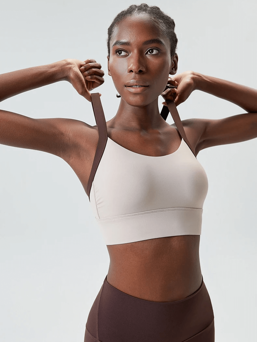 Woman wearing Women's Athletic Sports Two Color Bra Top SF2091, perfect for yoga and fitness with breathable, supportive design.